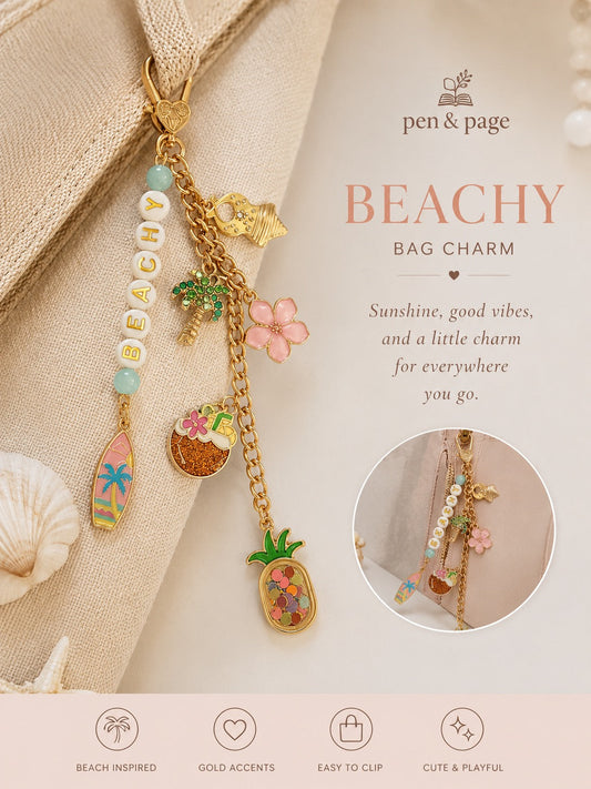 Beachy bag charm with gold accents and various charms on a beige background, featuring the brand 'pen & page'.