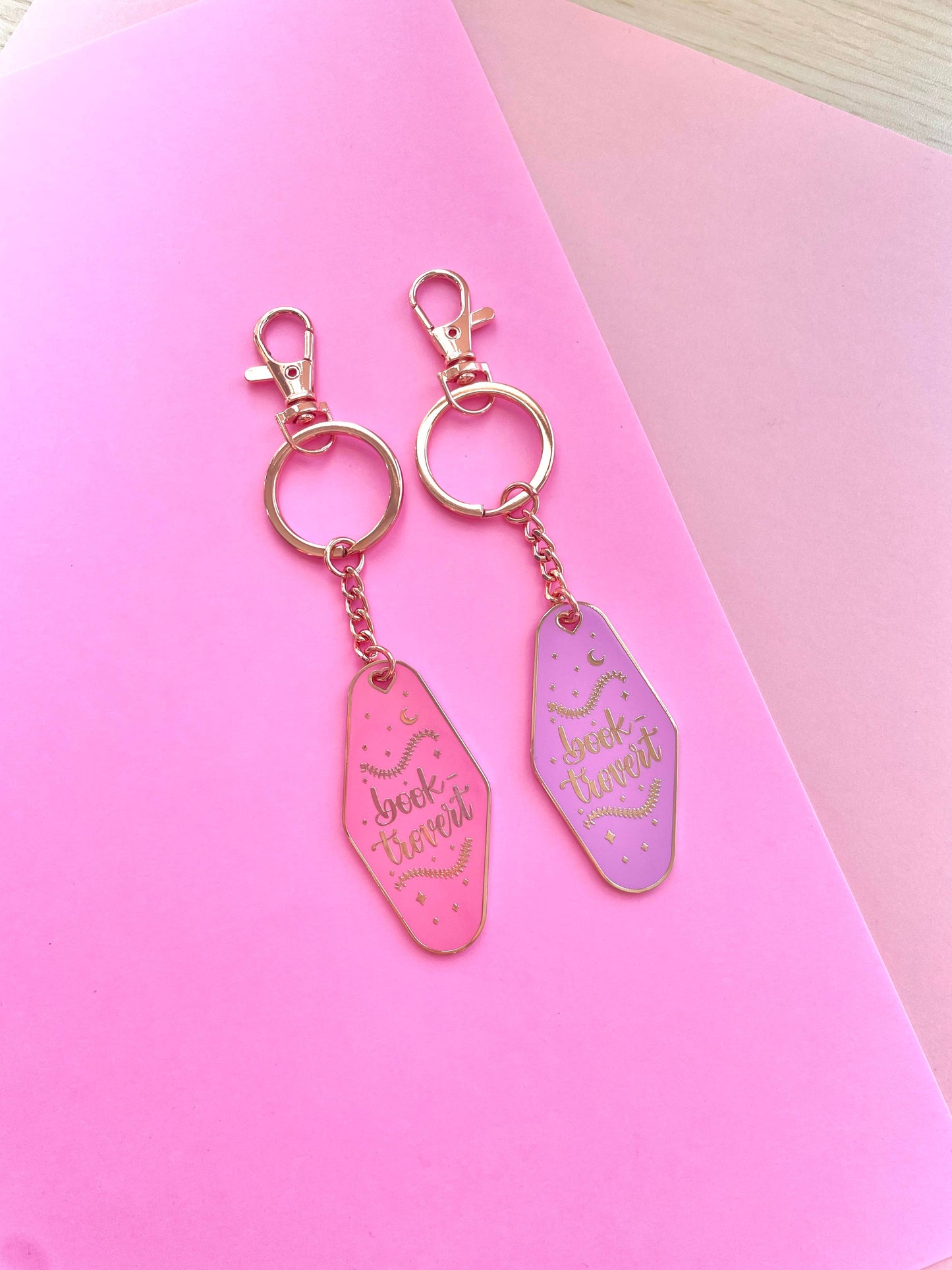 Booktrovert Hotel Keychain by Galloree Designs LLC in Pink metal with clip attachment and gold tone rings