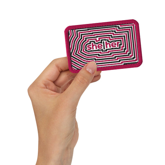 SheHer Pronoun Embroidered Patch by Spinsterly Co, maroon geometric twill patch with embroidered she her text