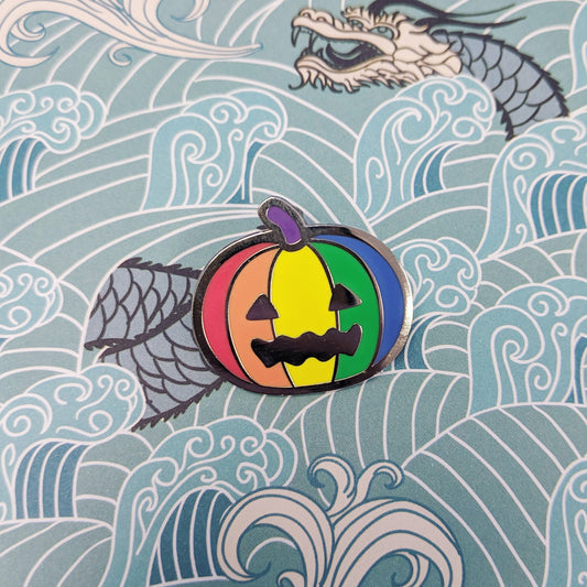 Queer-o-Lantern Hard Enamel Pin by Cunning Linguist Co. hard enamel and silver finish with rainbow pumpkin