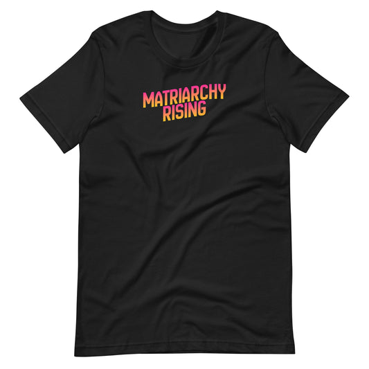 Black Matriarchy Rising t-shirt with bold sunrise-gradient lettering across the chest.