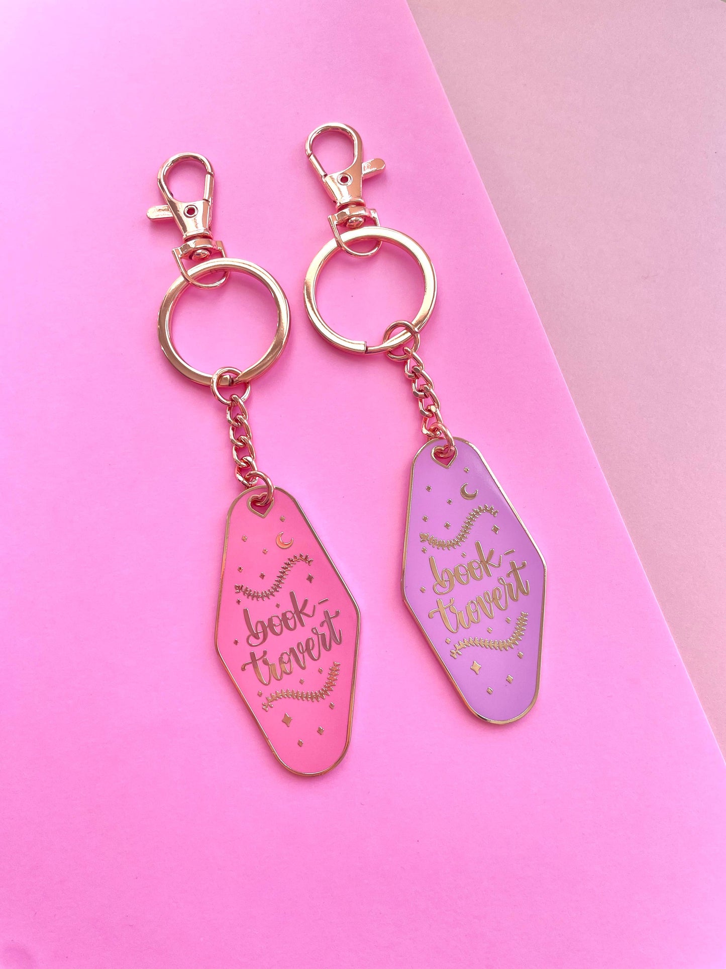 Booktrovert Hotel Keychain by Galloree Designs LLC in Pink metal with clip attachment and retro gold finish