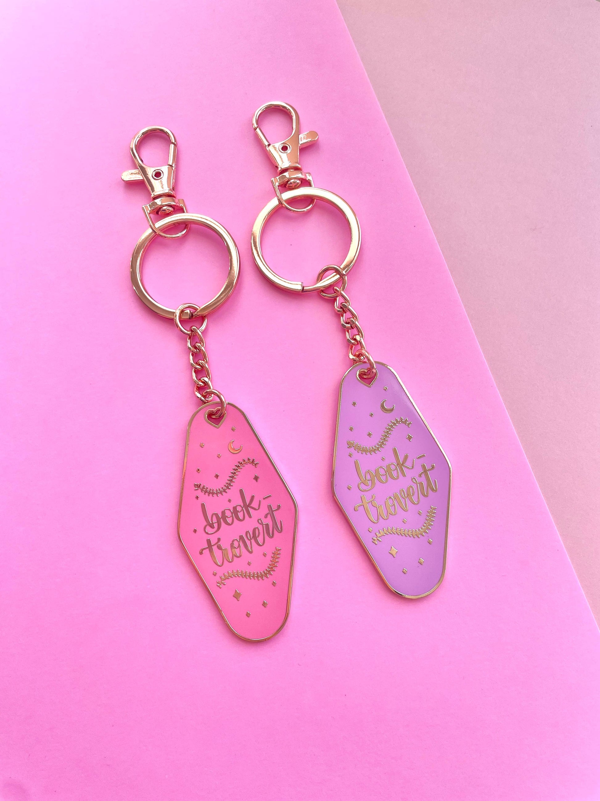 Booktrovert Hotel Keychain by Galloree Designs LLC in Pink metal with clip attachment and retro gold finish