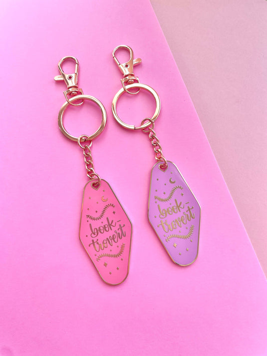 Booktrovert Hotel Keychain by Galloree Designs LLC in Pink metal with clip attachment and retro gold finish
