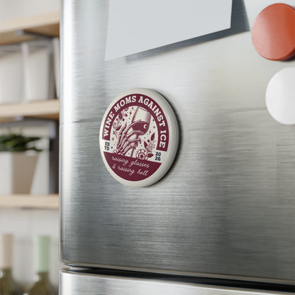 Wine Moms Against Ice Button Magnet by Spinsterly Co, round wine glass skeleton hand badge on a fridge