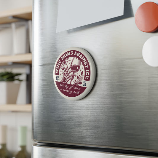 Wine Moms Against Ice Button Magnet by Spinsterly Co, round wine glass skeleton hand badge on a fridge