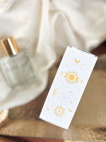 White box with sun and moon designs on a blurred background