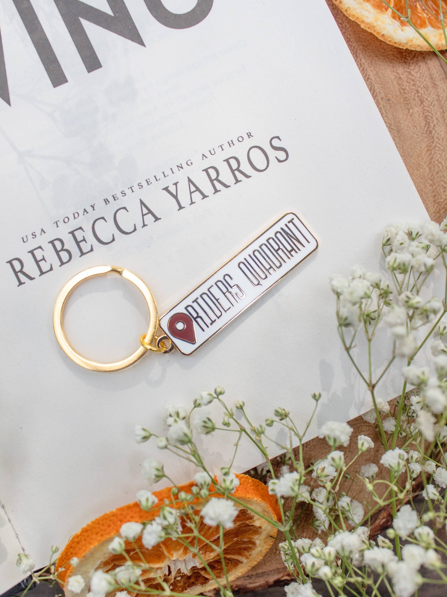 Riders Quadrant Location Keychain by Meaggie Moos hard enamel keychain with gold accents and fantasy fan art