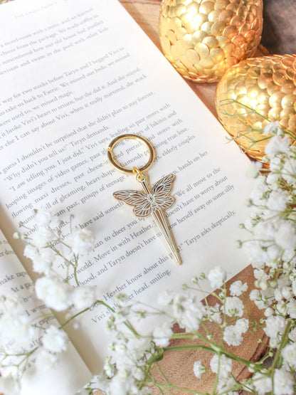 Faerie Dagger Enamel Keychain by Meaggie Moos in gold with hard enamel dagger and leaf charm