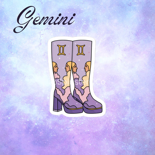 A die-cut sticker featuring a pair of purple high-heeled boots with Gemini zodiac artwork, displayed on a purple and blue galaxy background with the word 'Gemini' written at the top.
