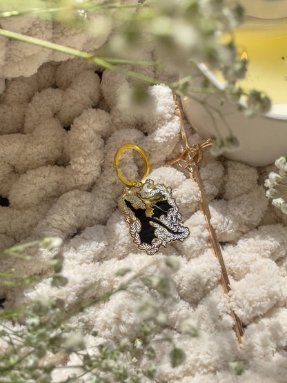 Dragon Bonded Pair Keychain Hard Enamel Fantasy Fan Art by Meaggie Moos, gold accents on a white plush background
