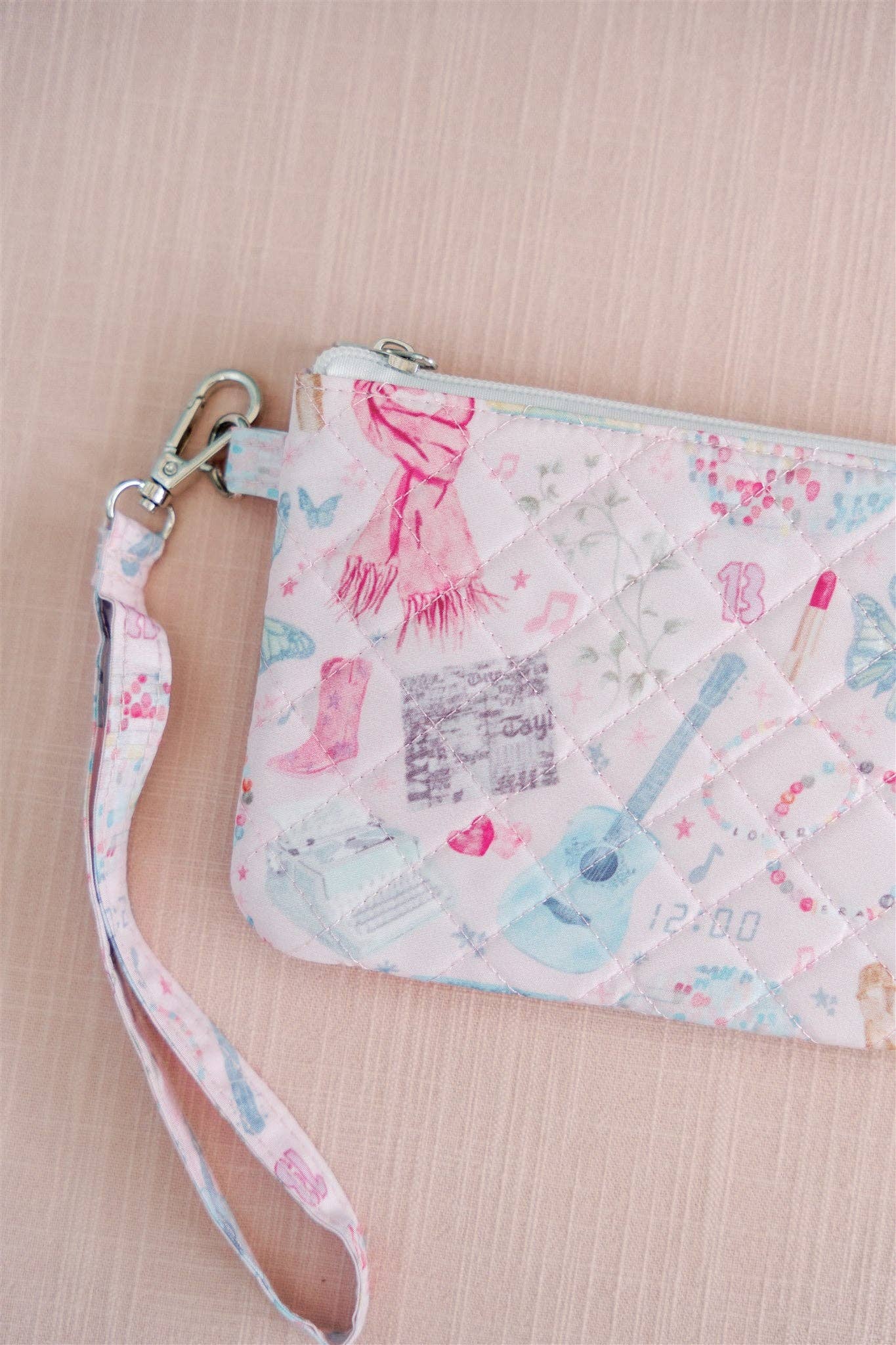Eras Quilted Wristlet Chic Fan Art Clutch Bag by Gracefully Made in pink and light blue with wrist strap