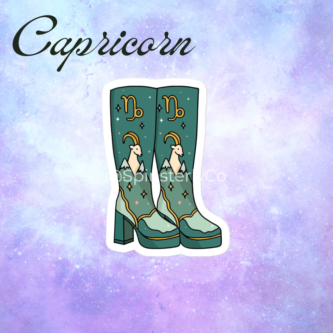 A die-cut sticker featuring a pair of teal cowboy boots decorated with a Capricorn zodiac illustration, shown against a pastel purple and blue galaxy background with the word 'Capricorn' written in black script at the top.