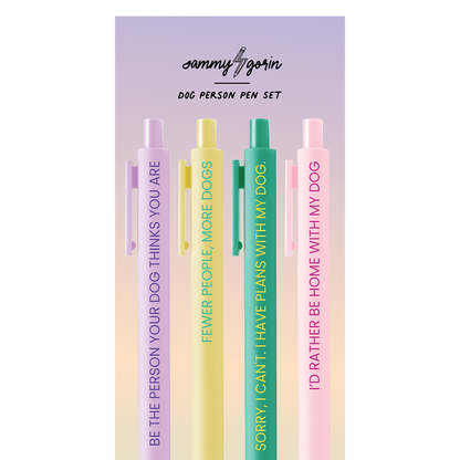 Set of four pens with humorous text in pastel colors on a purple background, featuring the brand 'Sammy Gorin'.