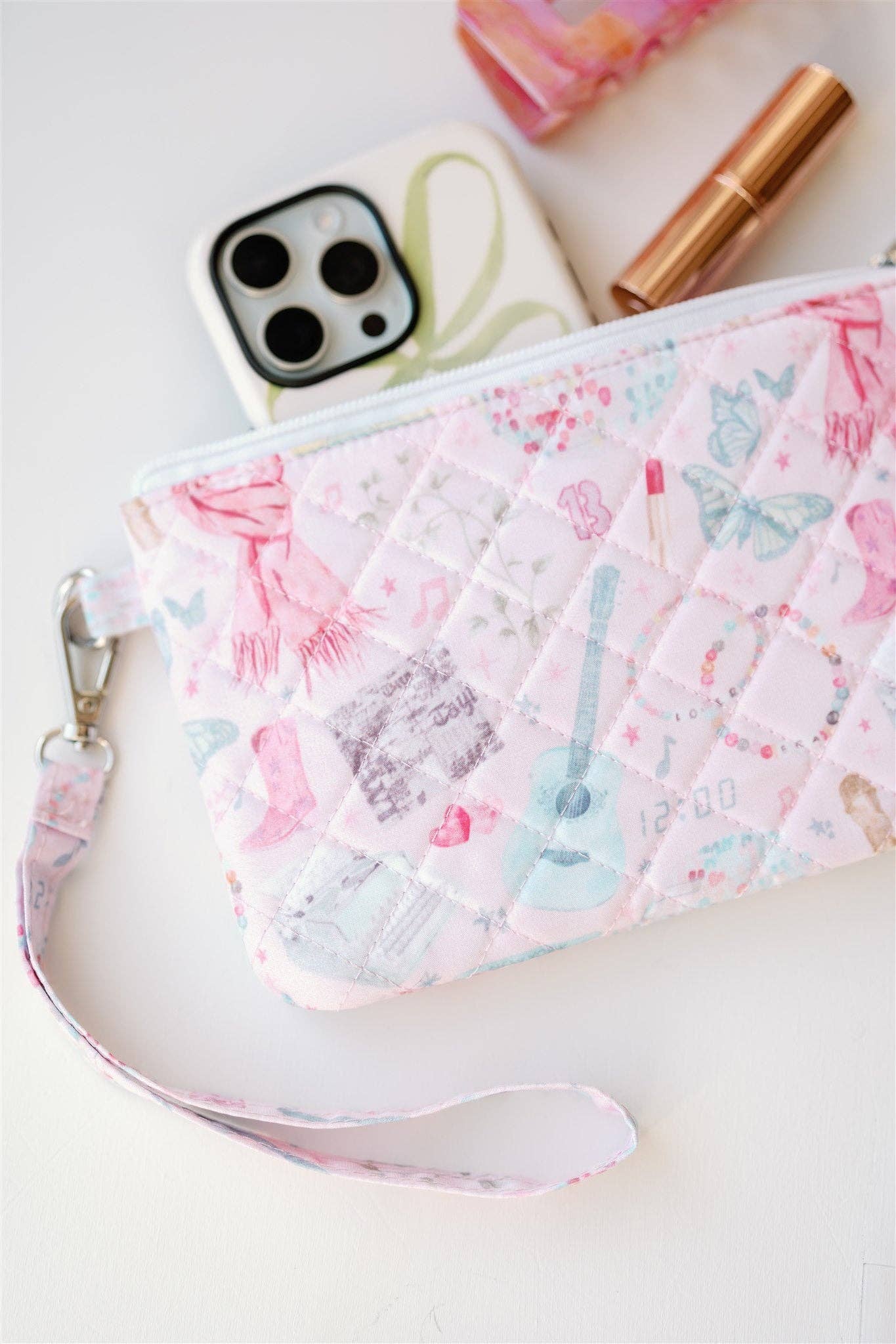 Eras Quilted Wristlet Chic Fan Art Clutch Bag by Gracefully Made, pink quilted exterior with wrist strap