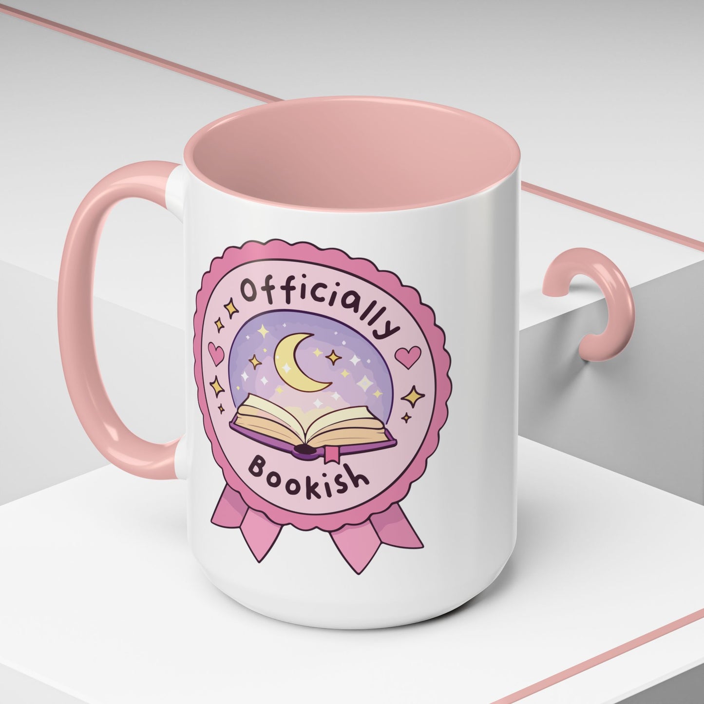Officially Bookish Accent Coffee Mug Spinsterly Co pink interior ceramic mug with rosette badge graphic