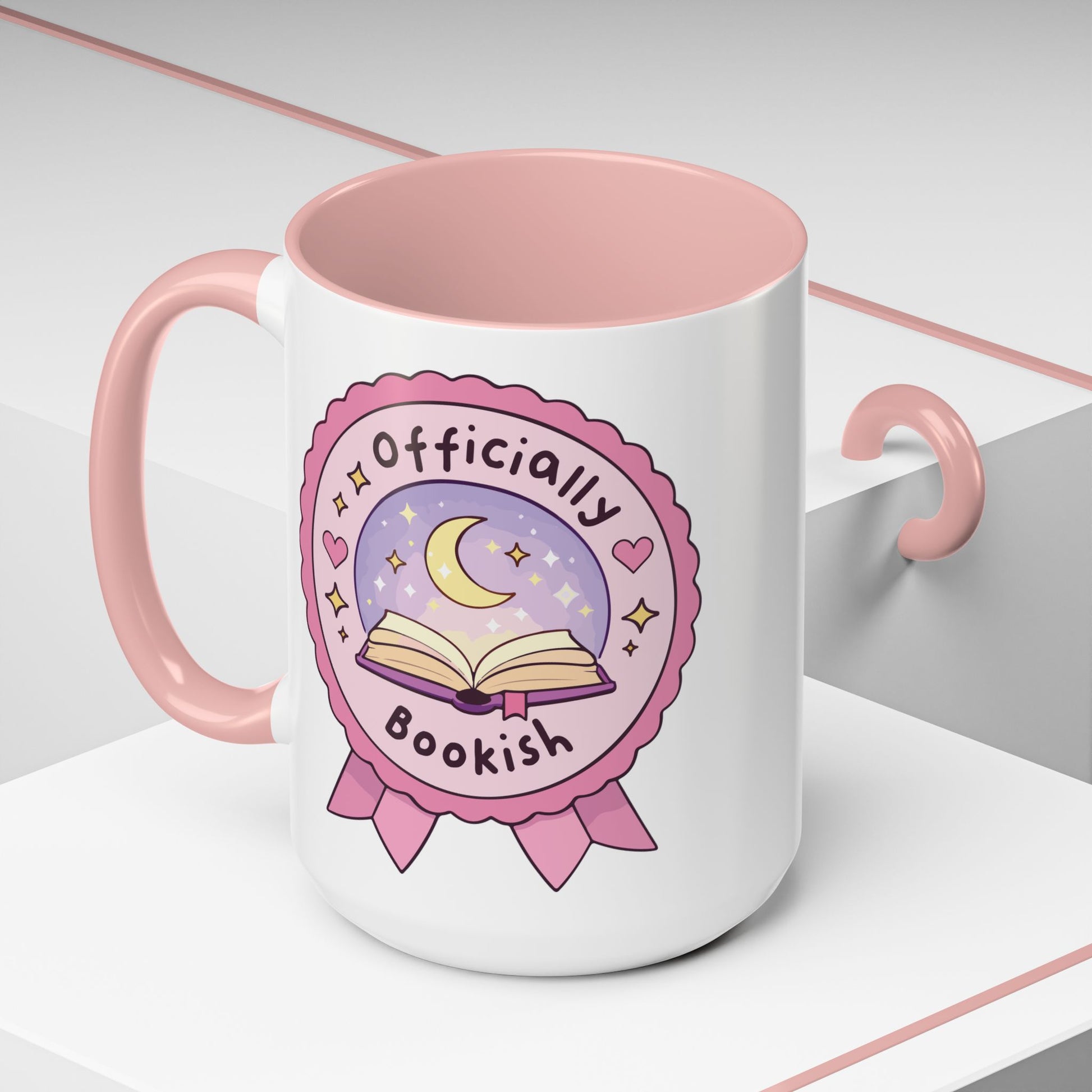 Officially Bookish Accent Coffee Mug Spinsterly Co pink interior ceramic mug with rosette badge graphic