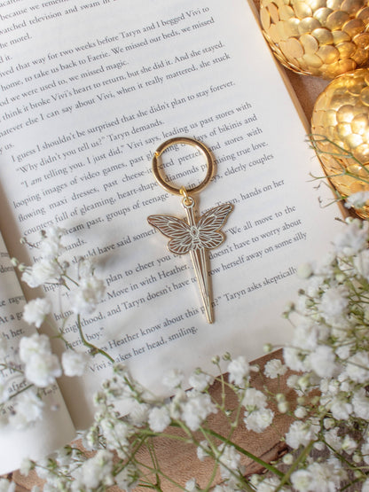 Faerie Dagger Enamel Keychain by Meaggie Moos with gold metal accents, hard enamel dagger charm