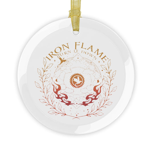 A round white ceramic ornament with a hanging loop, featuring a printed design with the words 'IRON FLAME' and 'TURN IT DOWN' in gold and red-orange tones, surrounding a central emblem and laurel wreath.