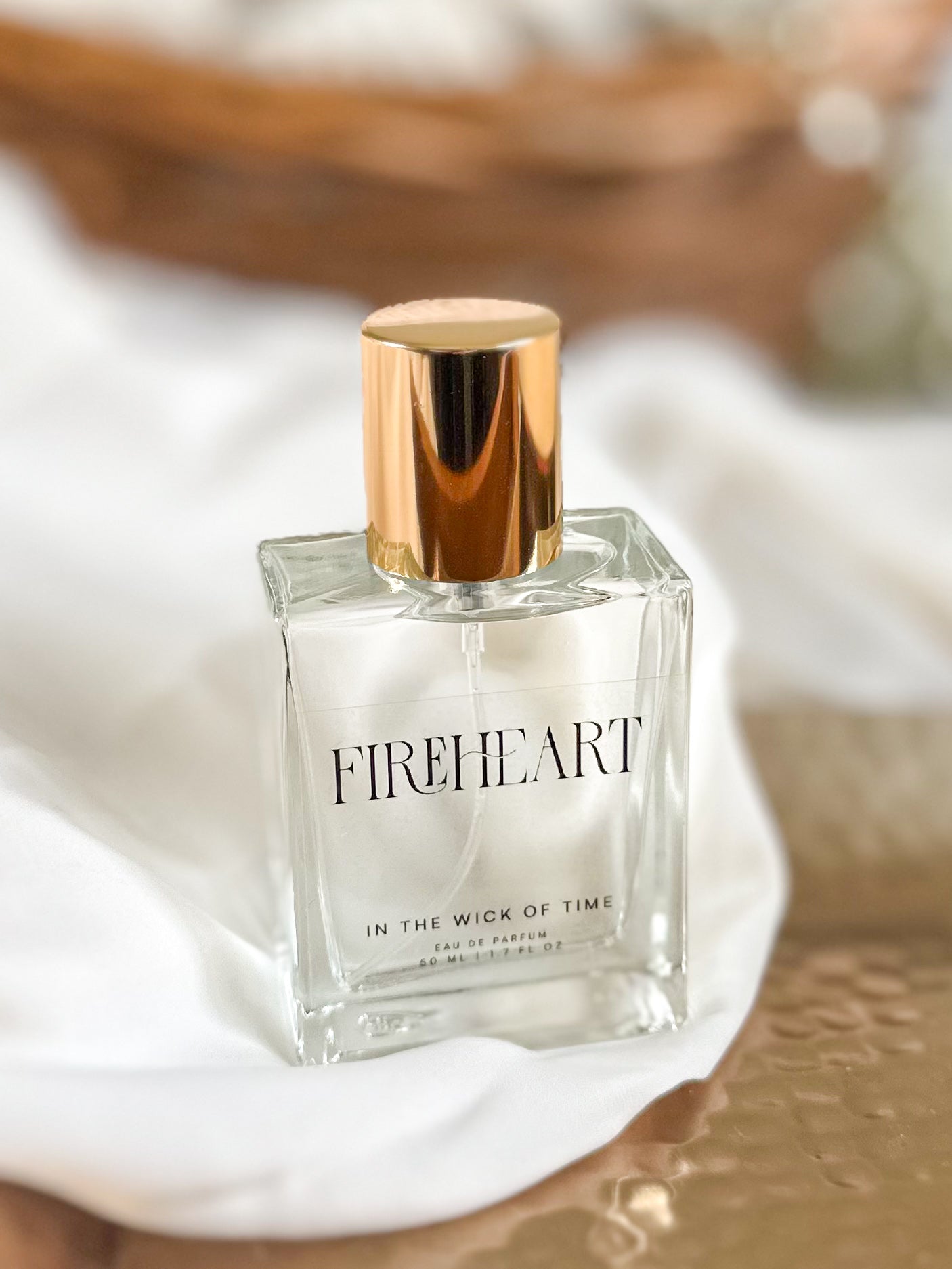Fireheart perfume bottle on a textured surface
