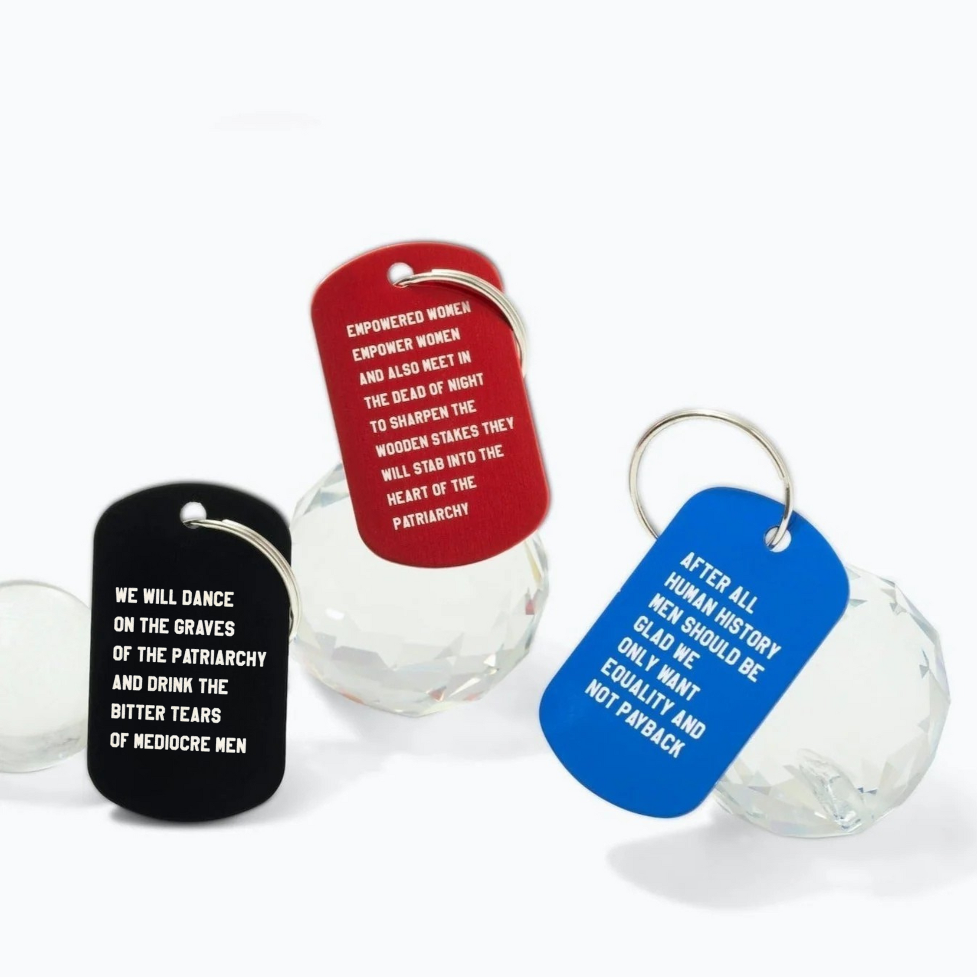 Three dog tags with text on a white background