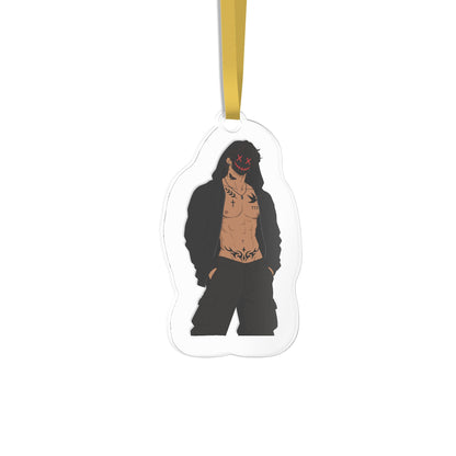 An acrylic hanging ornament shaped like a character, featuring a printed illustration of a shirtless man with tattoos, black hair, and a black mask with red facial features, suspended by a gold ribbon on a white background.