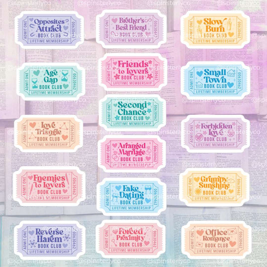 A sheet of 16 retro-style book club ticket stickers arranged in a grid on a pastel purple background. The tickets feature various colorful designs in lavender, pink, blue, yellow, and peach, each with a unique quote like 'Opposites Attract' or 'Friends to Love' and the text 'LIFETIME MEMBERSHIP'.