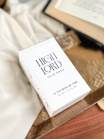 Box of 'High Lord' perfume on a wooden surface with a blurred background