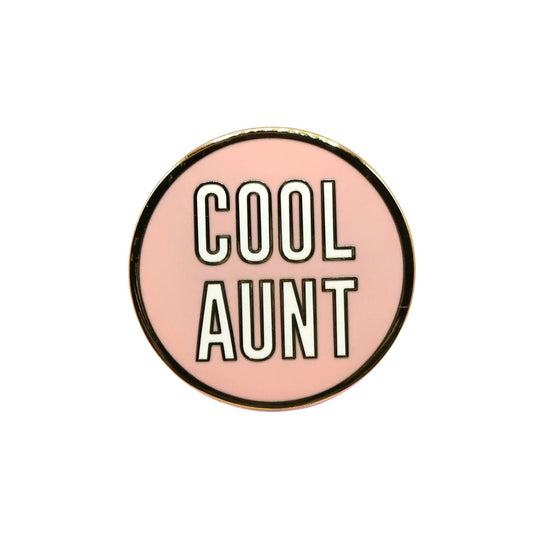 Round pink enamel pin with 'Cool Aunt' text on a white background