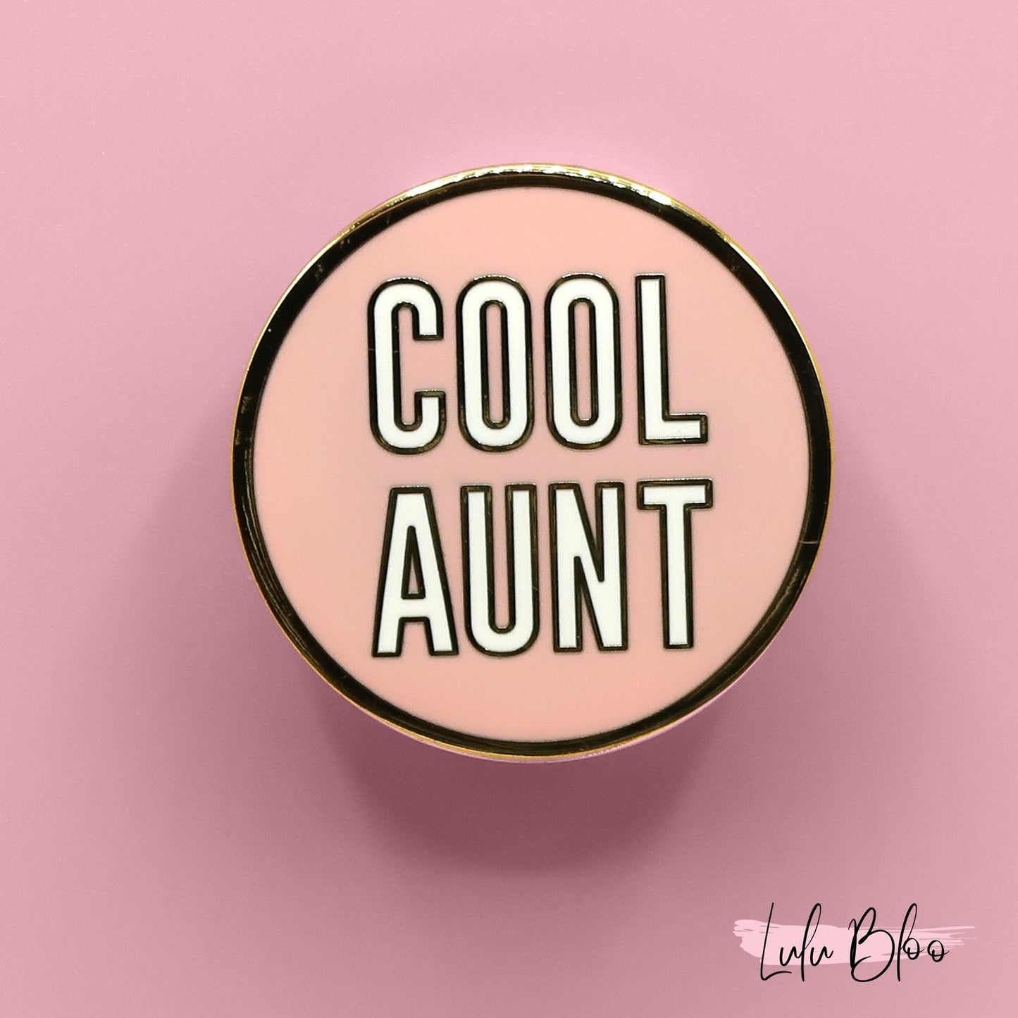 Pin with 'COOL AUNT' text on a pink background