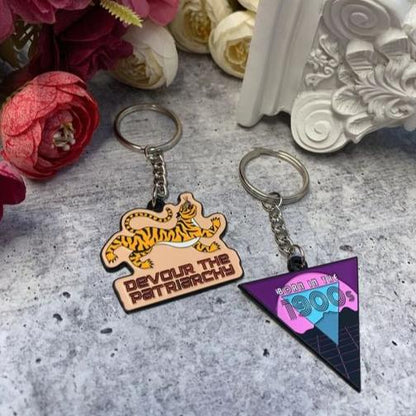 Devour the Patriarchy Feminist Enamel Keychain by The Bullish Store with tiger motif in orange and purple