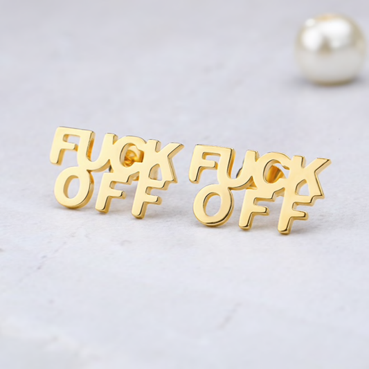 Gold 'F*CK OFF' earrings on a light gray background