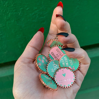 Feminist AF Enamel Pin by The Bullish Store, pink and green stripes, wheel-shaped enamel and metal construction