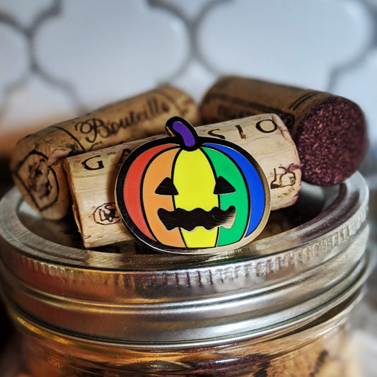 Queer-o-Lantern Hard Enamel Pin by Cunning Linguist Co. rainbow pride design on silver metal finish