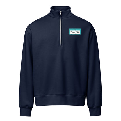 A navy blue quarter-zip sweatshirt with a square graphic of a name sticker that reads "Hello My Name is Jane Doe, in support of survivors of sexual violence on the left chest, displayed on a clean white background.