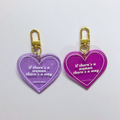 Two heart-shaped keychains with gold clasps on a white background.