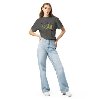 Woman wearing a green t-shirt with text that reads 'RESTING WITHC FACE' and light blue jeans on a white background