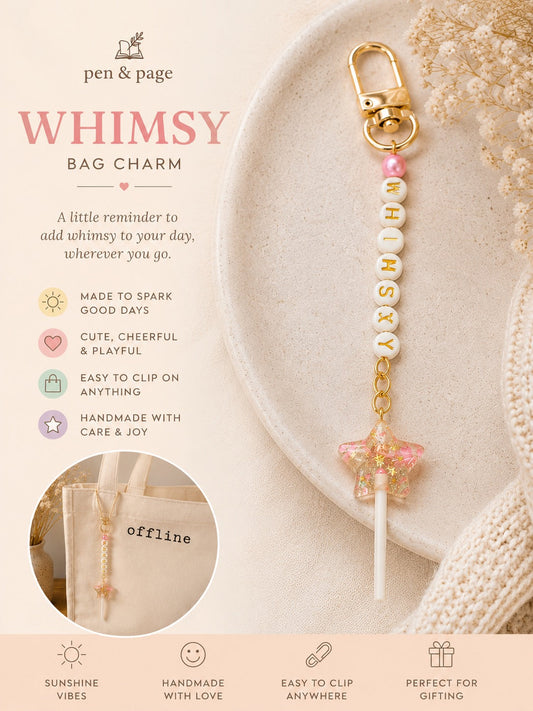 Bag charm with beads and gold accents on a plate and letter beads spelling whimsey with a star shaped lollipop charm, featuring 'pen & page' branding.