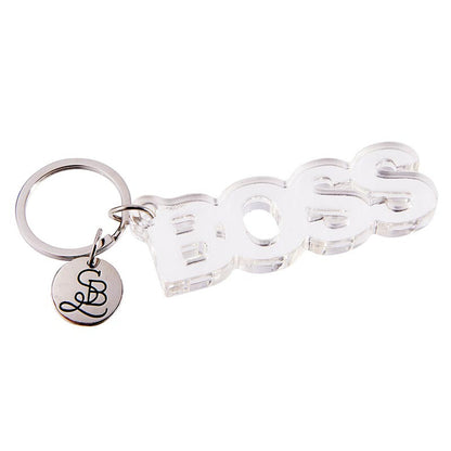 Keychain with 'BOSS' letters and a small round charm on a white background
