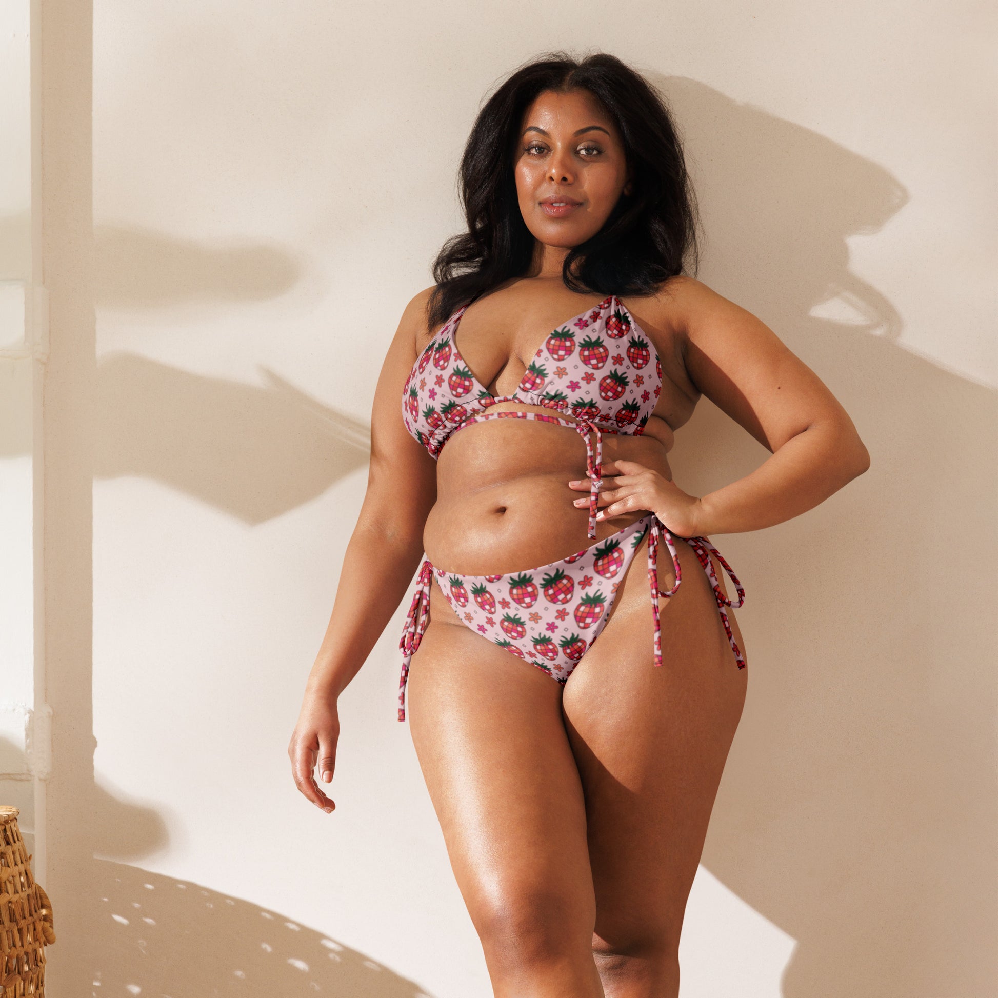 Strawberry Fields String Bikini by Spinsterly Co in white strawberry print with adjustable tie sides