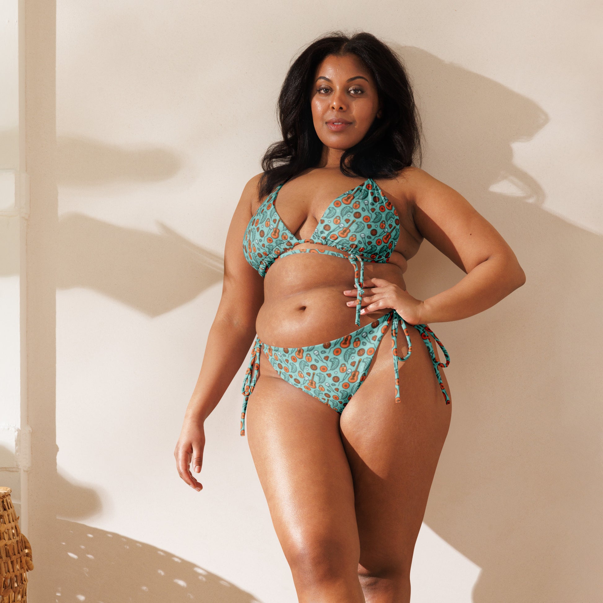 Showgirl Era String Bikini by Spinsterly Co in teal all-over print with tie side bottoms