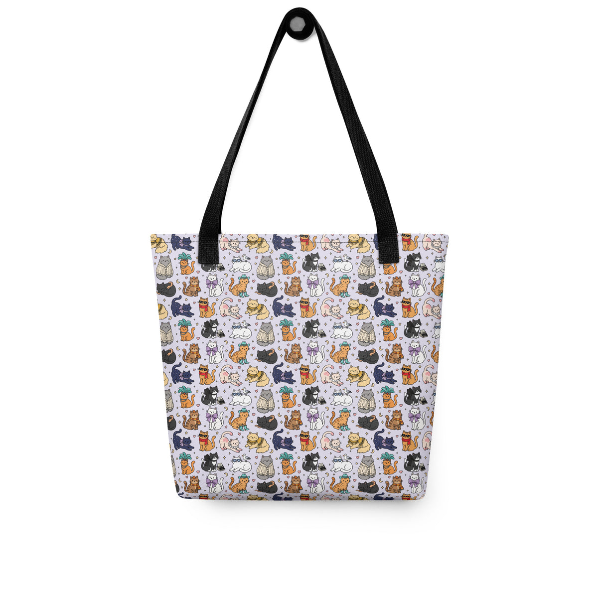 A tote bag with a white background and an all-over repeating pattern of small illustrated cats in various colors. The bag has black shoulder straps and is photographed against a plain white background.