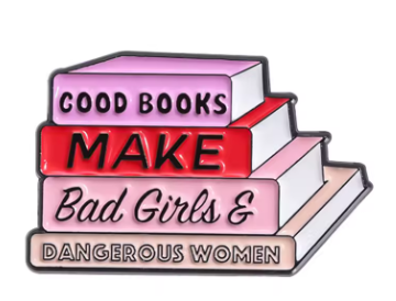A stacked books enamel pin with the text 'GOOD BOOKS MAKE Bad Girls & DANGEROUS WOMEN' on a white background.