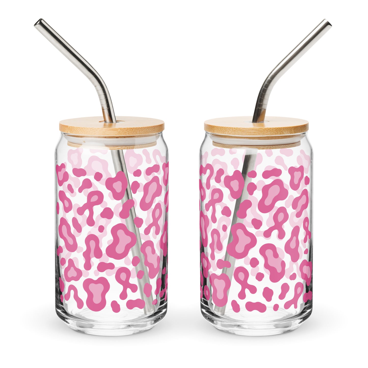 Two clear glass tumblers with pink leopard print patterns, bamboo lids, and curved stainless steel straws, shown on a white background.