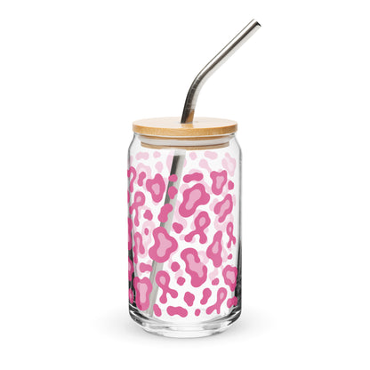 A clear glass can-shaped tumbler with a pink leopard print pattern, a light wood lid, and a curved stainless steel straw, shown on a white background.