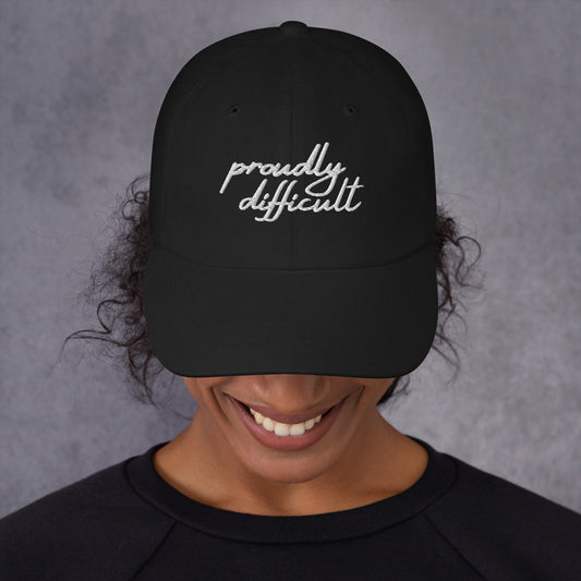 Proudly Difficult Dad Hat Feminist Embroidered Baseball Cap by Spinsterly Co, black with white stitched slogan