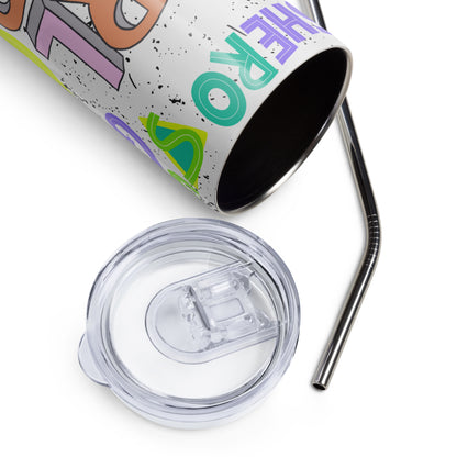 A close-up product shot of a stainless steel tumbler with a clear lid and metal straw on a white background. The tumbler has a white base with colorful graphic lettering and paint splatter details.