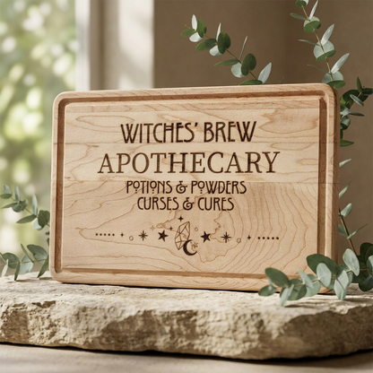 Witches' Brew Apothecary Engraved Wooden Cutting Board by Spinsterly Co in walnut with drip ring and moon text