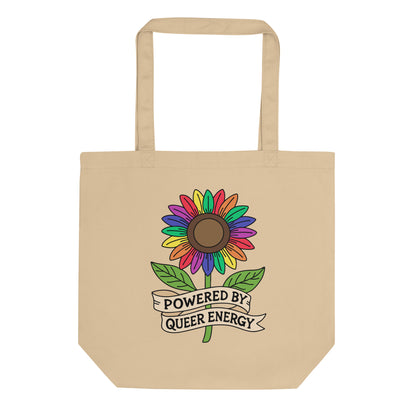 Powered by Queer Energy Eco Tote Bag by Spinsterly Co in beige with rainbow sunflower graphic and ribbon