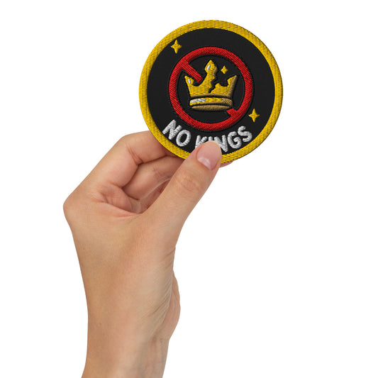 No Kings Embroidered Iron-On Patch by Spinsterly Co, black and yellow patch with crossed-out crown symbol